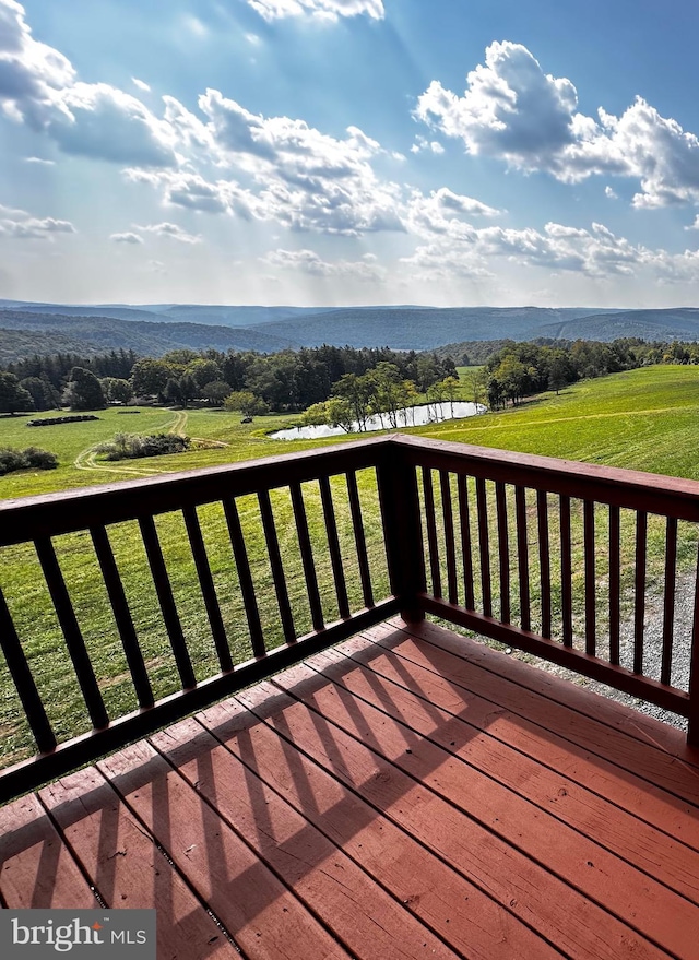 wooden deck featuring a rural view