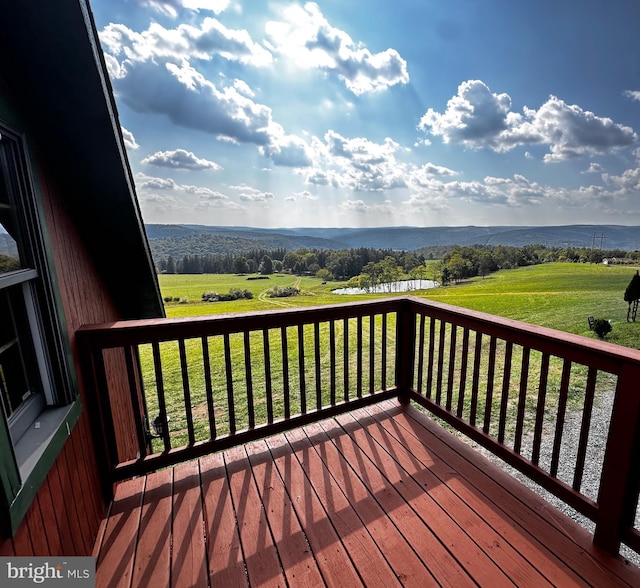 wooden terrace with a mountain view and a rural view