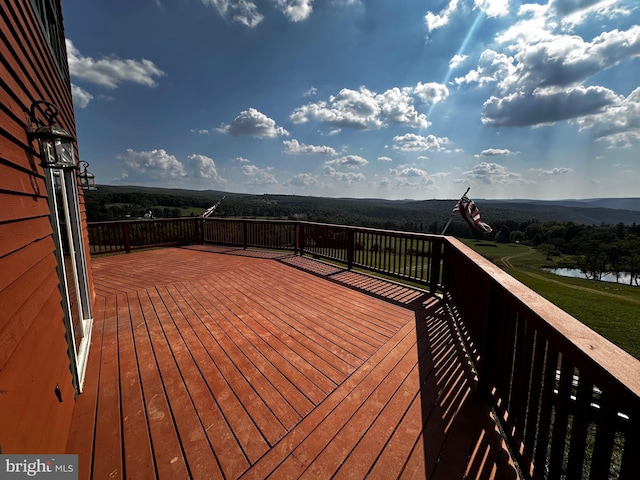 wooden terrace with a water view