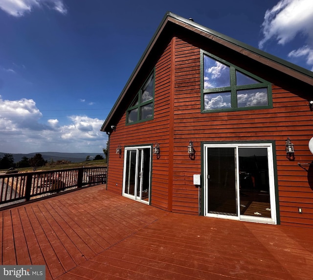 wooden deck featuring a mountain view