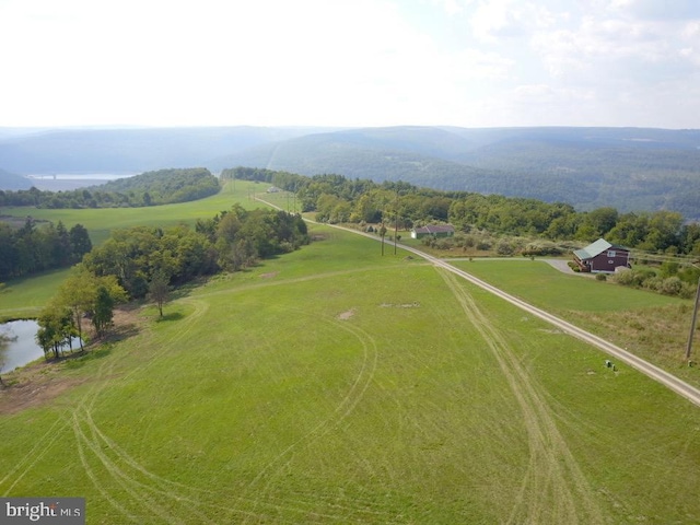 aerial view with a rural view and a water and mountain view