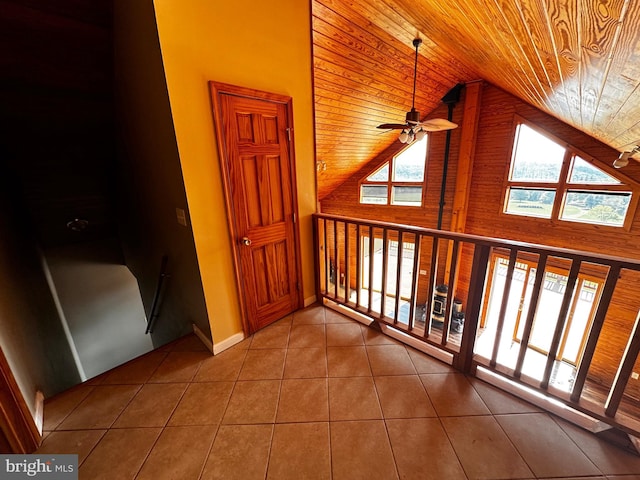 bonus room with high vaulted ceiling, tile patterned flooring, baseboards, wood ceiling, and ceiling fan