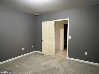 unfurnished bedroom with baseboards