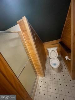 bathroom with tile patterned floors and toilet