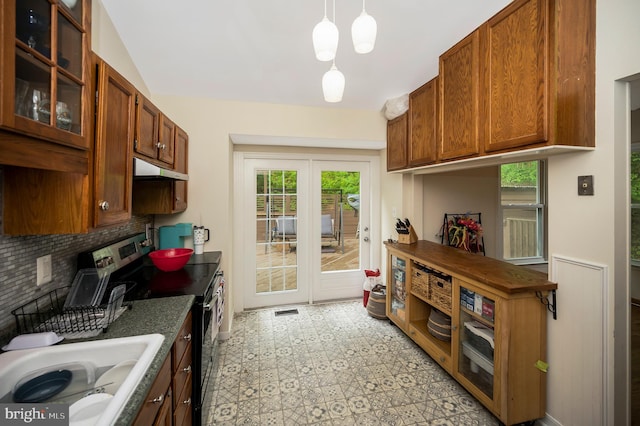 2036 Coast Guard Dr, Stafford, VA 22554 - kitchen featuring electric range, a sink, backsplash, dark countertops, and glass insert cabinets