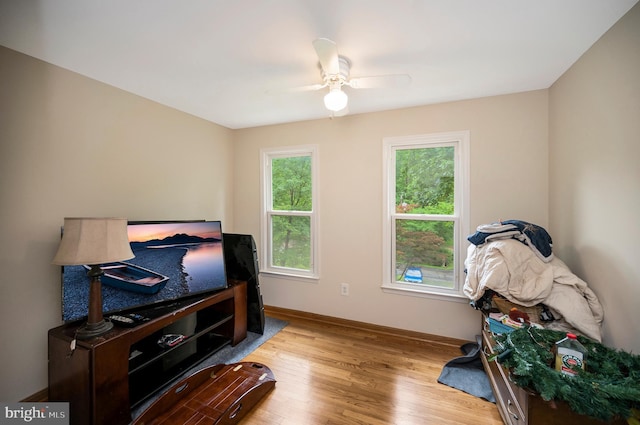 2036 Coast Guard Dr, Stafford, VA 22554 - living area featuring wood finished floors, a ceiling fan, and baseboards