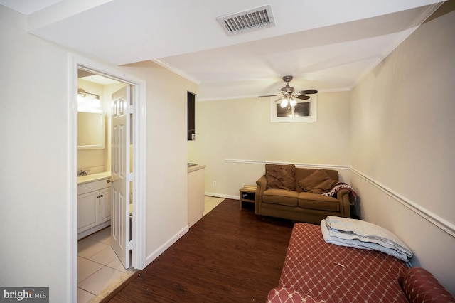 2036 Coast Guard Dr, Stafford, VA 22554 - living area featuring wood finished floors, ceiling fan, and ornamental molding