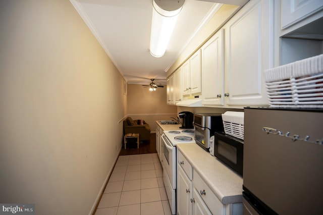 2036 Coast Guard Dr, Stafford, VA 22554 - kitchen with black microwave, white range with electric cooktop, ornamental molding, white cabinetry, and light tile patterned flooring