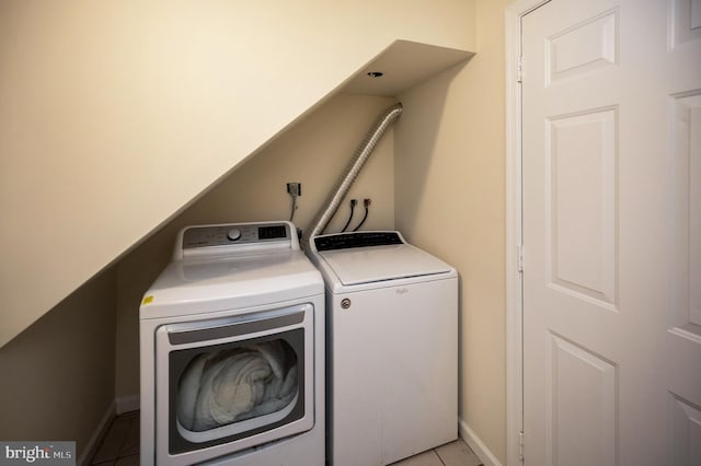 2036 Coast Guard Dr, Stafford, VA 22554 - laundry room with separate washer and dryer, light tile patterned flooring, and baseboards