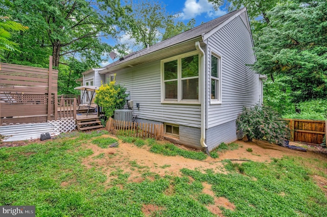 2036 Coast Guard Dr, Stafford, VA 22554 - view of side of property featuring a wooden deck and central AC