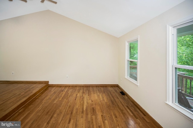 2036 Coast Guard Dr, Stafford, VA 22554 - unfurnished room with vaulted ceiling, wood finished floors, healthy amount of natural light, and baseboards