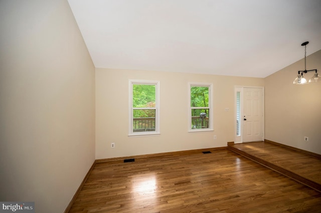 2036 Coast Guard Dr, Stafford, VA 22554 - unfurnished room featuring wood finished floors, lofted ceiling, and baseboards