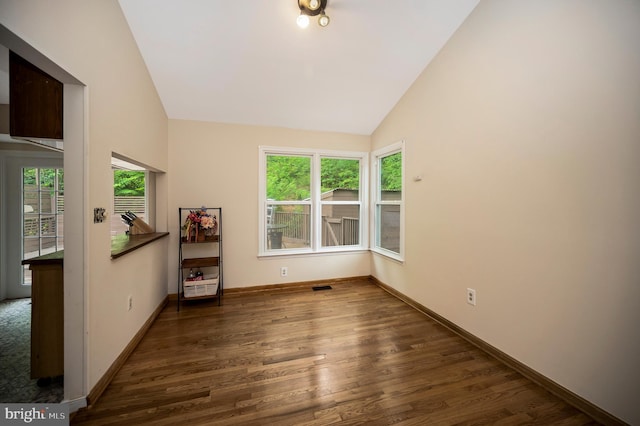 2036 Coast Guard Dr, Stafford, VA 22554 - unfurnished room with lofted ceiling, wood finished floors, and baseboards