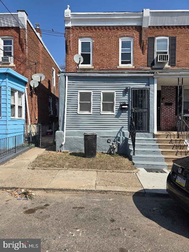 multi unit property with cooling unit and brick siding