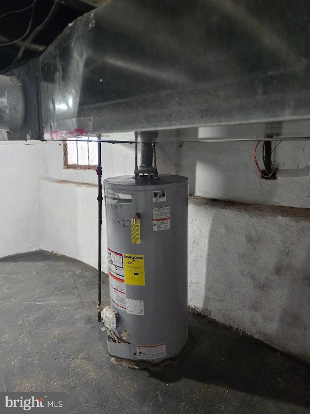 utility room featuring gas water heater