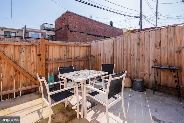 view of patio / terrace featuring outdoor dining area and a fenced backyard