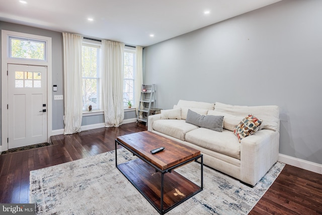 living room with recessed lighting, baseboards, and hardwood / wood-style floors