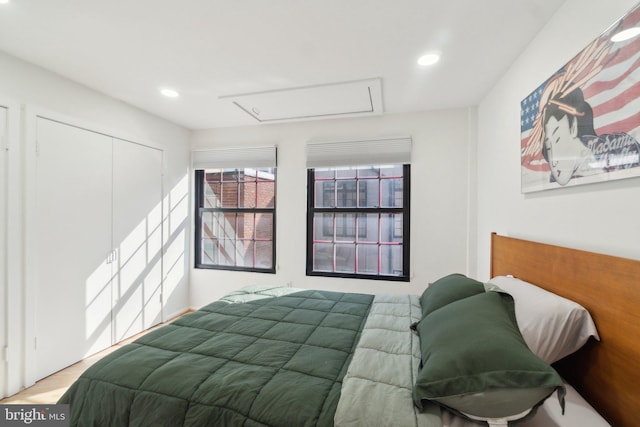 bedroom with a closet and recessed lighting