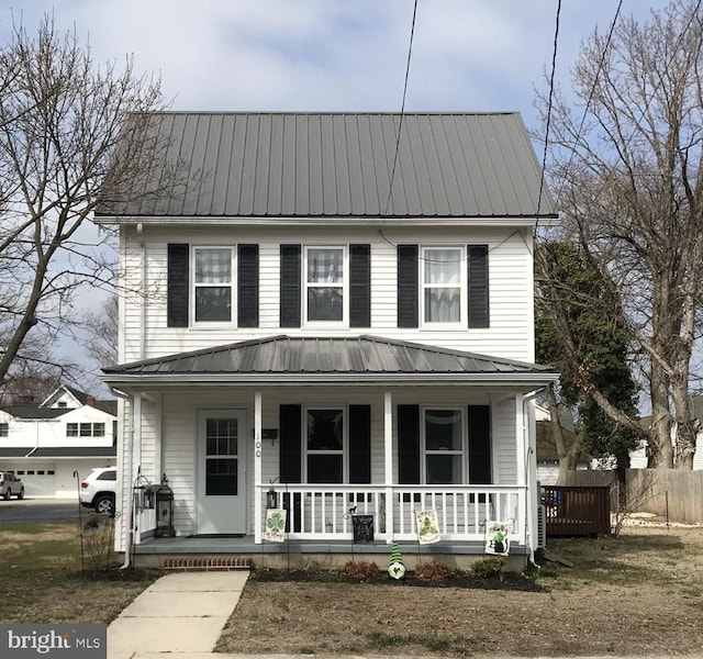 view of front of house featuring metal roof and a porch