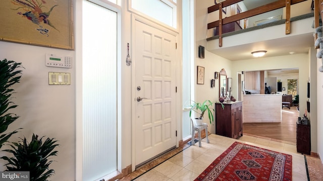 foyer entrance featuring light tile patterned floors