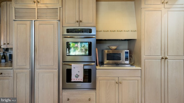 kitchen with light brown cabinetry and stainless steel appliances