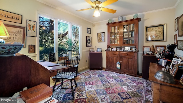 office with a ceiling fan, baseboards, and ornamental molding