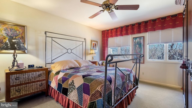 bedroom with baseboards, a ceiling fan, and carpet flooring