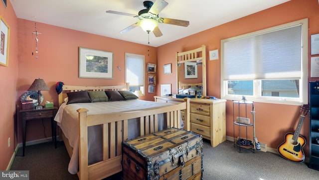 carpeted bedroom featuring a ceiling fan and baseboards