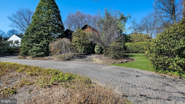 view of property exterior with a yard