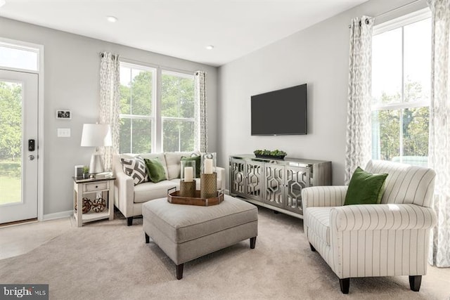 living room with light carpet, recessed lighting, and baseboards