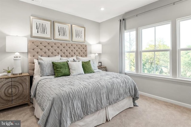 bedroom with recessed lighting, baseboards, carpet floors, and multiple windows