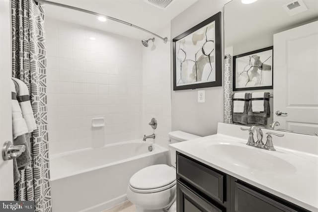 bathroom featuring visible vents, vanity, toilet, and shower / tub combo with curtain