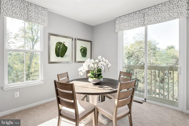 dining area with visible vents, baseboards, and carpet