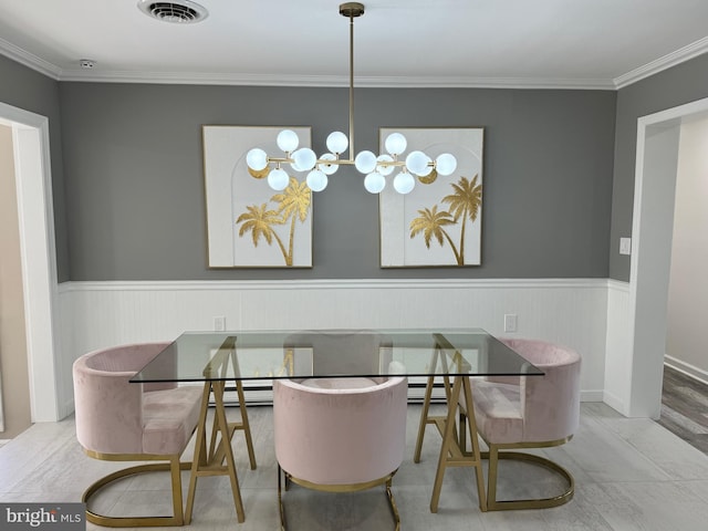 dining room featuring a wainscoted wall, crown molding, a notable chandelier, and visible vents