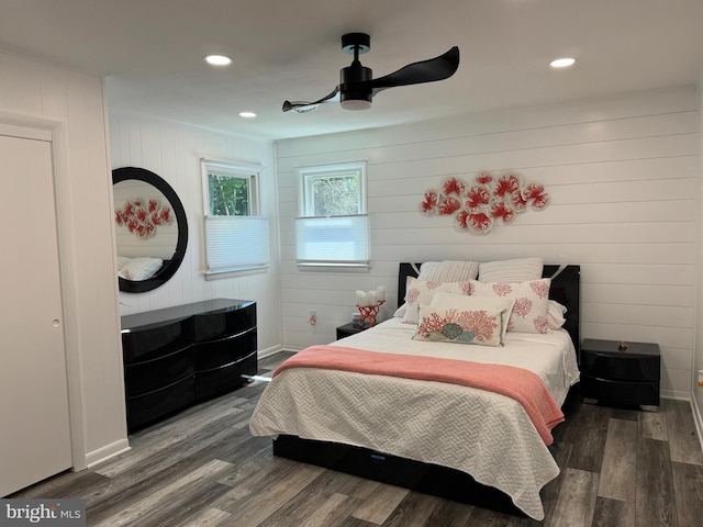 bedroom featuring recessed lighting, wood finished floors, and baseboards