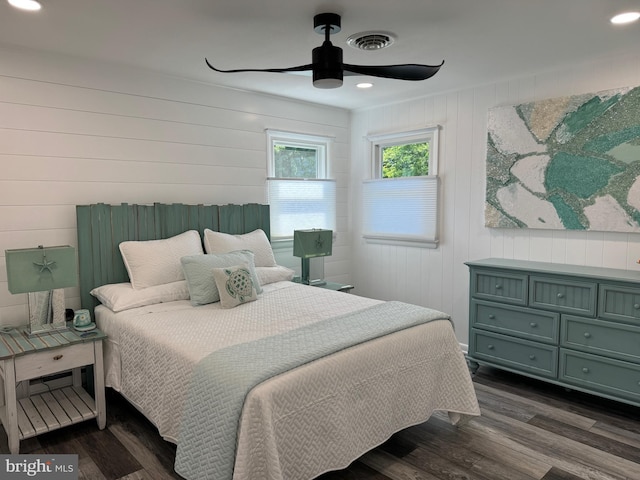 bedroom featuring dark wood-style floors, visible vents, and recessed lighting