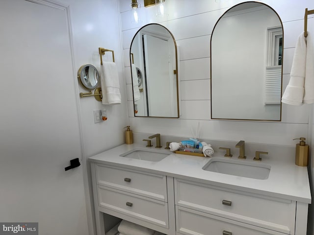 bathroom featuring double vanity and a sink