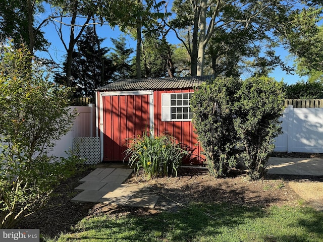 view of shed featuring a fenced backyard