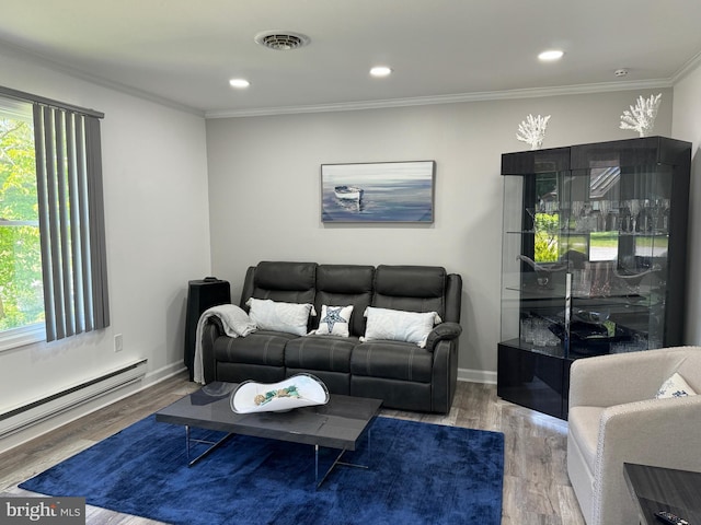 living room with wood finished floors, baseboards, visible vents, ornamental molding, and baseboard heating