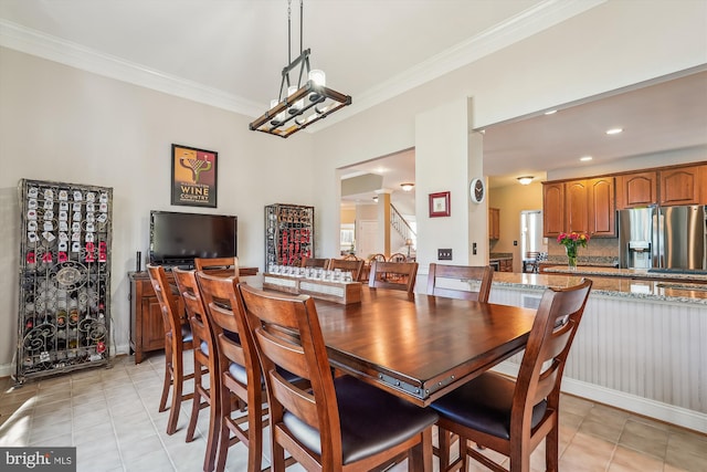 dining room featuring light tile patterned floors, plenty of natural light, stairs, and crown molding