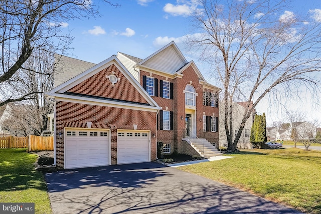 view of front of property featuring brick siding, fence, aphalt driveway, a front yard, and a garage