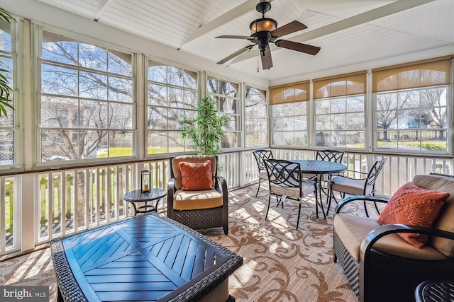 sunroom featuring ceiling fan