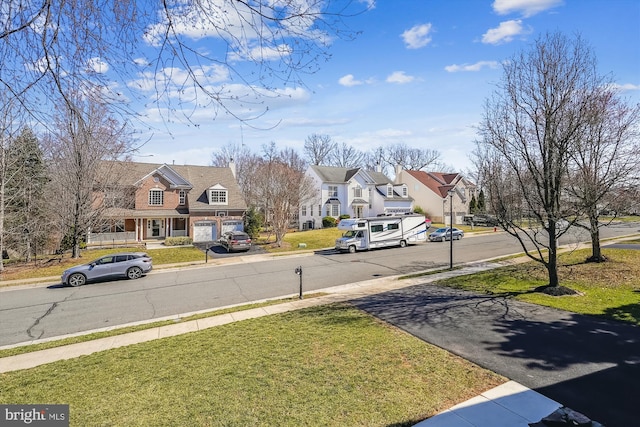 view of road with sidewalks and a residential view