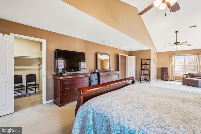 bedroom with visible vents, baseboards, light colored carpet, ceiling fan, and vaulted ceiling