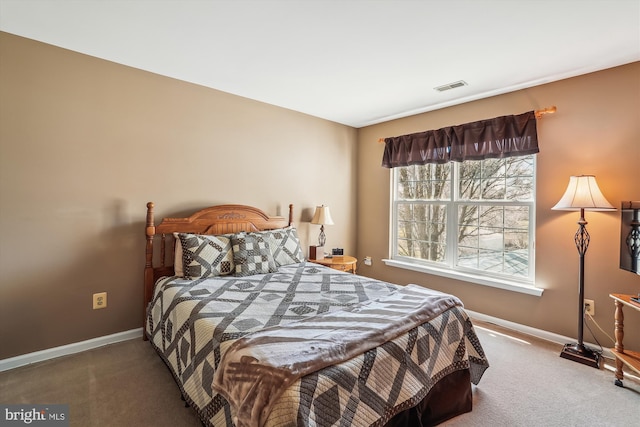 carpeted bedroom featuring visible vents and baseboards