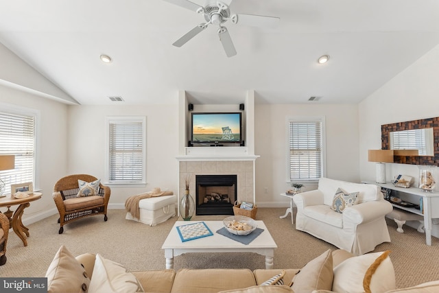 living area featuring visible vents, a ceiling fan, lofted ceiling, and carpet floors