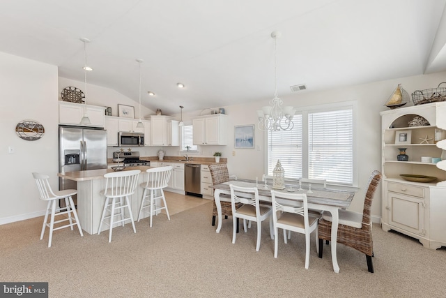 dining room with baseboards, visible vents, vaulted ceiling, light carpet, and a notable chandelier