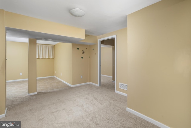 interior space with visible vents, baseboards, and carpet floors