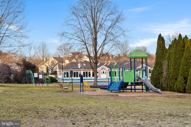 community play area with a lawn