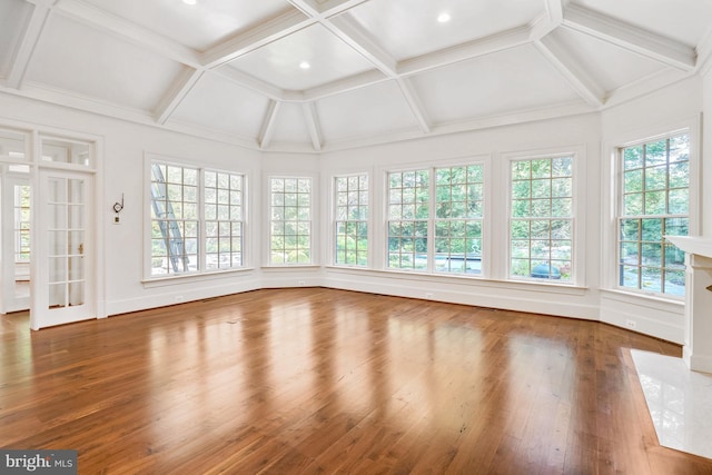 unfurnished sunroom with beamed ceiling and coffered ceiling